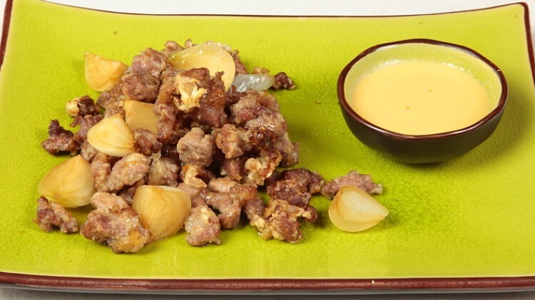 Agnello con cipolle novelle