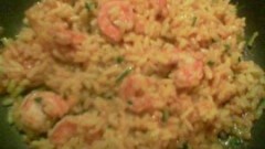 Risotto al curry e zafferano con gamberi in salsa