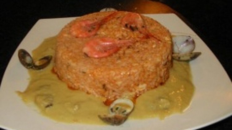 Timballo di riso al sugo di scorfano su crema di gamberi di nassa e vongole veraci