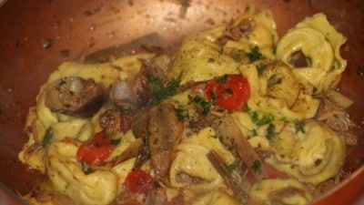 Ravioli di branzino alle vongole e carciofi